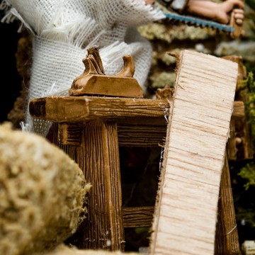 Carpenter with Saw and Plane