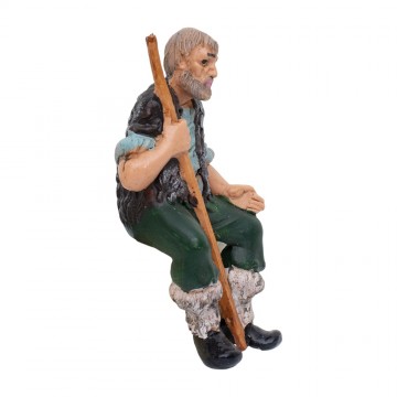 Sitting Man with Stick...