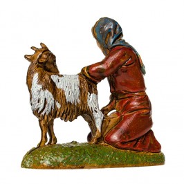 Woman Kneeling Milking a Goat