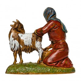 Woman Kneeling Milking a Goat